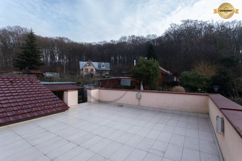 View from the terrace of a family house on Borinská Street in Marianka with a forest background.