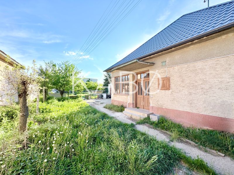 A family house in Šoporňa with a large garden and an entrance veranda.