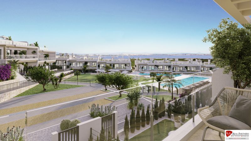2-bedroom apartment in Torrevieja with a view of the pool and greenery.