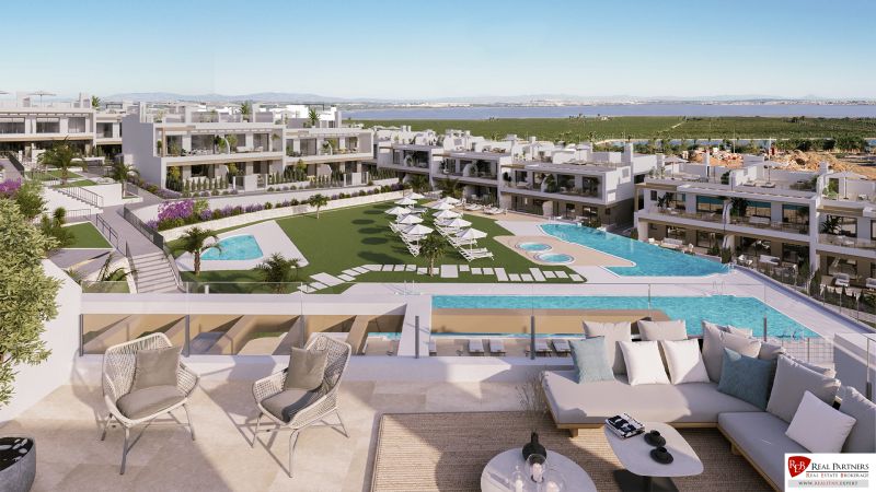 Luxury residential complex in Torrevieja with pools, garden, and lagoon views.