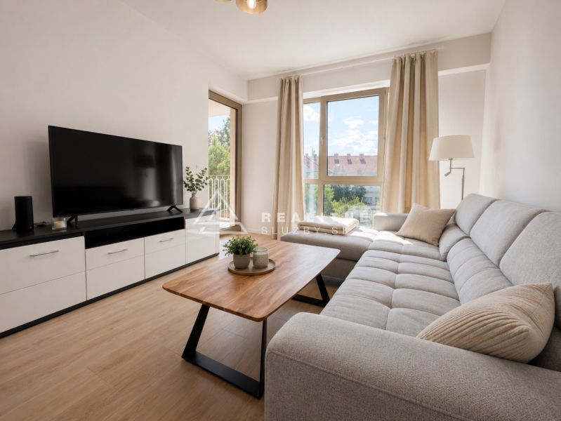 Living room in a two-room apartment with a sofa and a wooden decor floor.