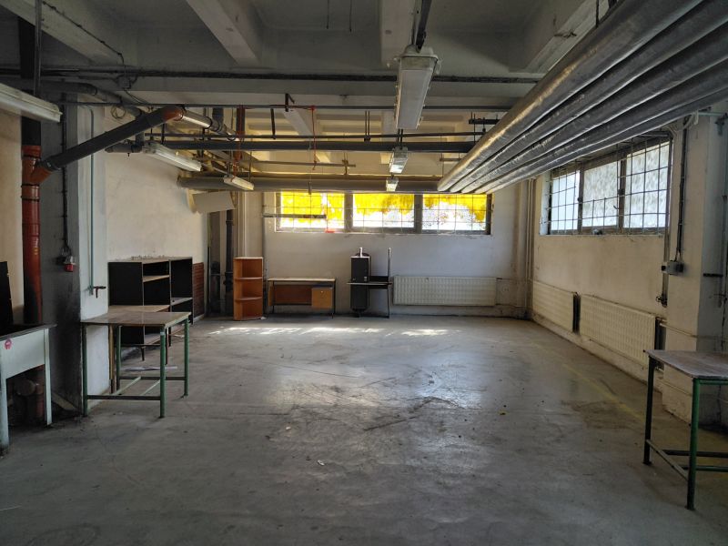 Industrial interior with pipes and old equipment in the warehouse and hall.