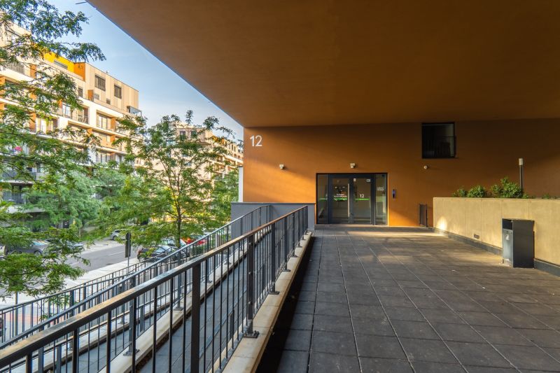 The exterior of the property on Zuzany Chalupovej Street, Bratislava - Petržalka, at the entrance with a barrier.
