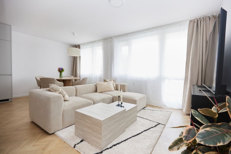 Living room with a comfortable sofa and a coffee table in a 4-room apartment.
