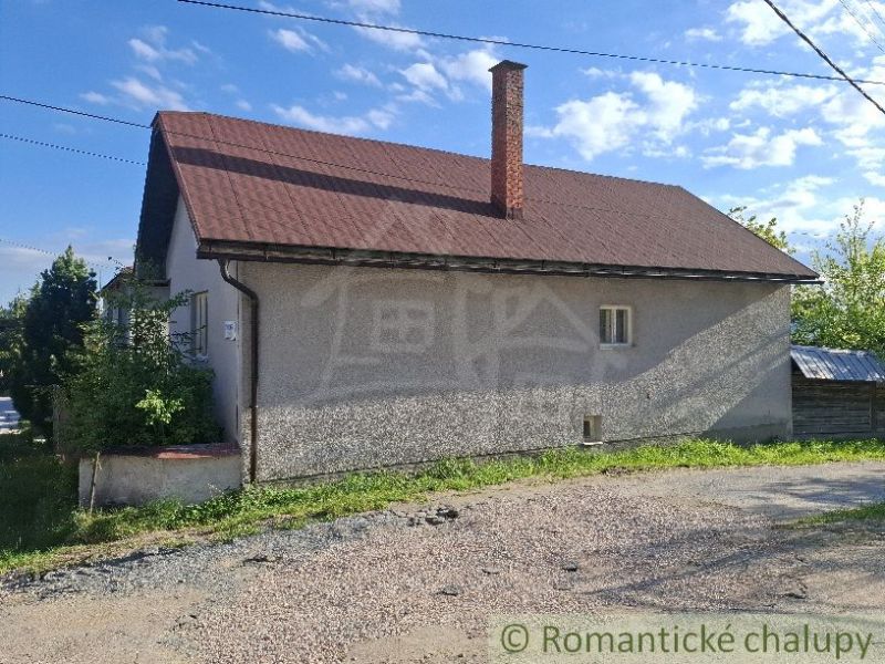 A family house in Šumiac with a simple facade and a sloped roof.