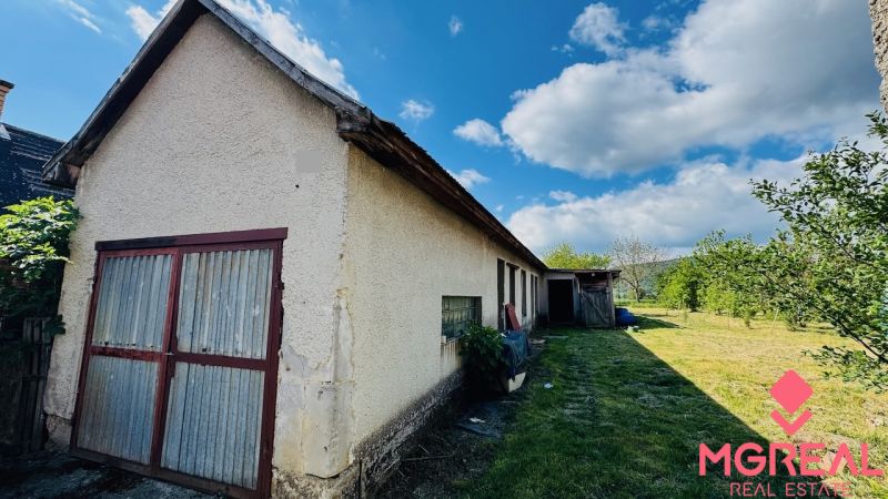 Family house in Pažiť with an extension, garden, sunny weather.