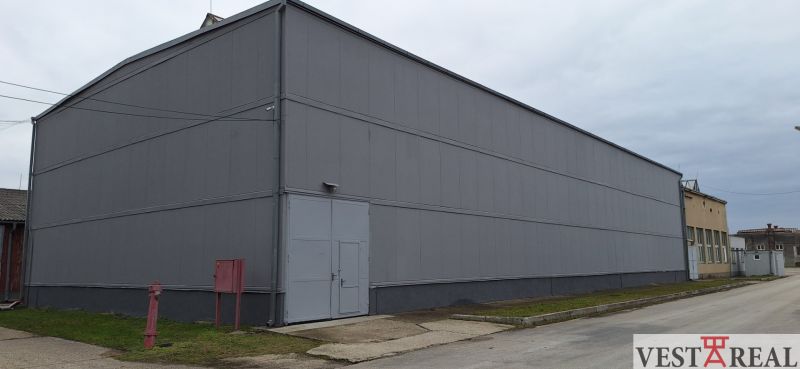 Warehouses and halls on Priemyselná Street in Galanta, a spacious gray building with an industrial appearance.
