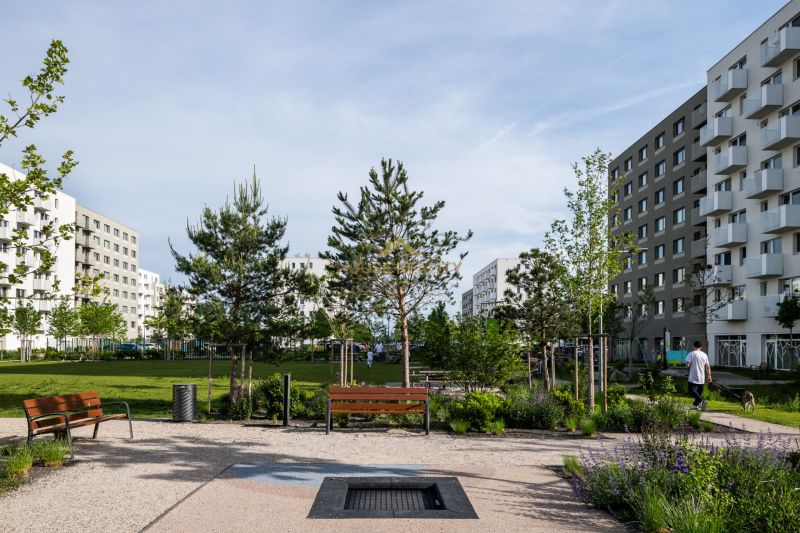 A park area with benches surrounded by greenery on Ivanská cesta in Bratislava, Ružinov.
