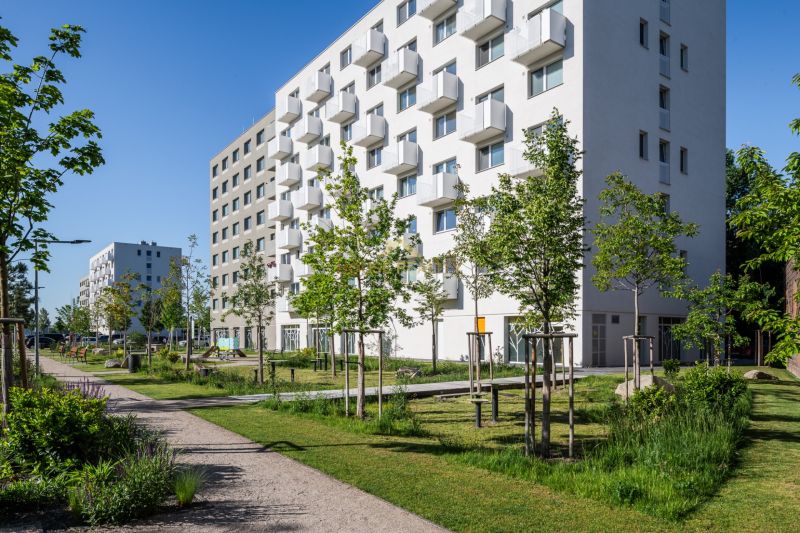 Apartment building in Bratislava - Ružinov on Ivanská cesta with a green park in the surroundings.