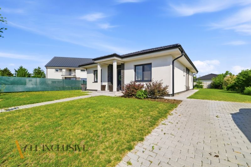A family house in Veľké Blahovo in Dunajská Streda with a grassy plot and a paved walkway.