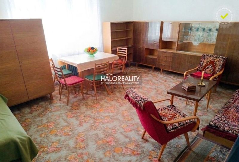 Living room in a family house with historical furnishings and wooden furniture.