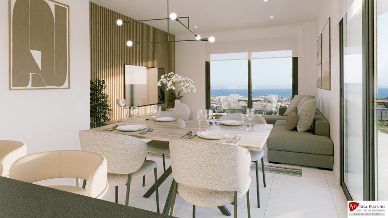 Dining area of a recreational apartment with a sea view and elegant table setting.