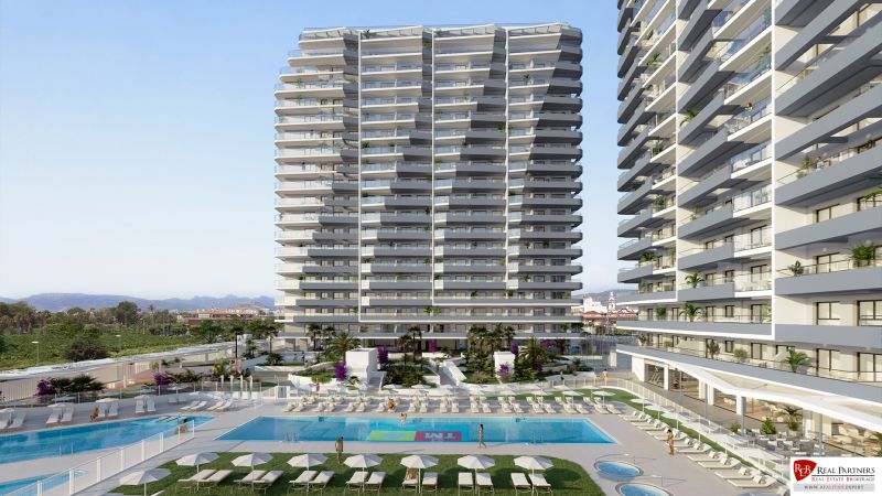 A holiday apartment in Canet d'En Berenguer with a garden and a pool near residential towers.