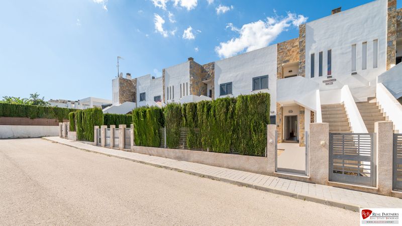 A recreational apartment in Cala Murada, Mallorca, with terraced housing surrounded by greenery.
