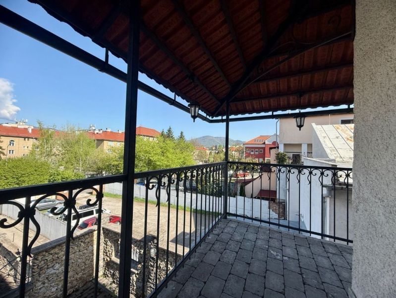 View of Unique Properties in Banská Bystrica with a Balcony and Roof Structure.