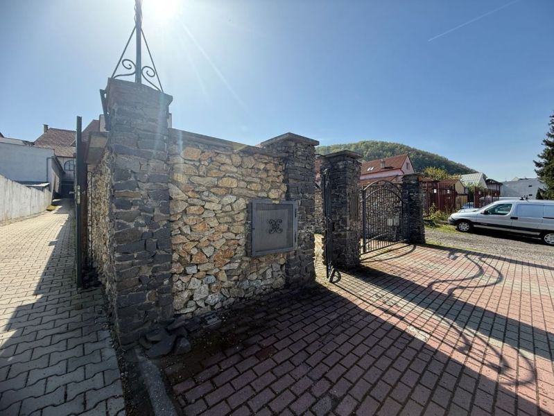 Stone gate and brick road in Banská Bystrica, Unusual properties.