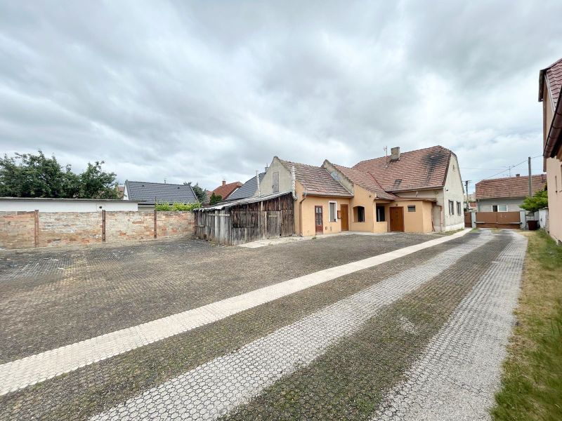 Family house on Krajinská Street in Bratislava - Podunajské Biskupice with a paved courtyard.