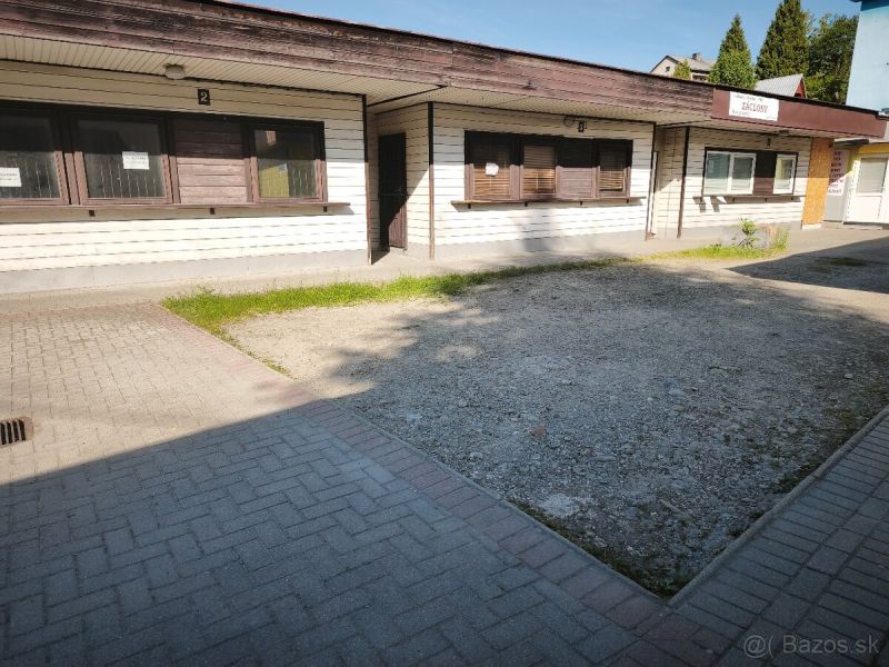 Commercial premises in Turzovka with a simple facade and paved access.