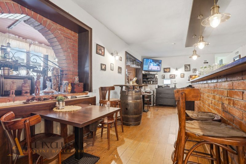 Wooden floor decor, brick walls, and comfortable seating in dining spaces.