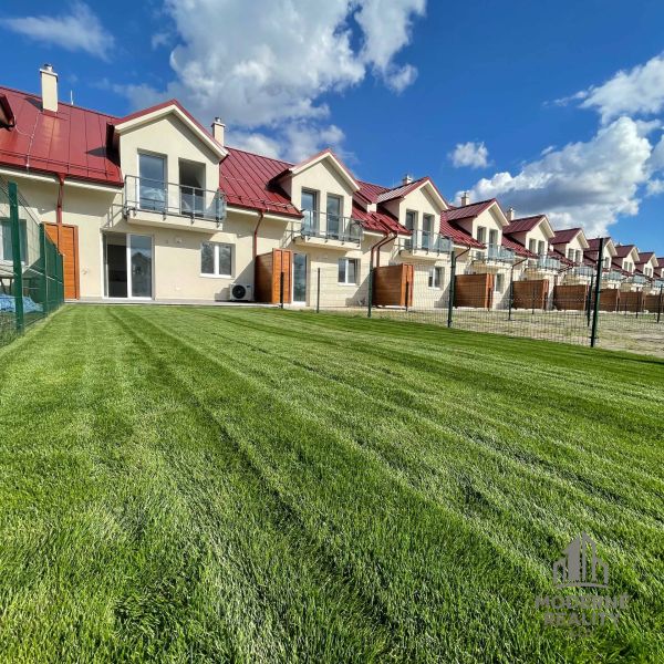 Family houses in Andovce with gardens and balconies, ideal for family living.