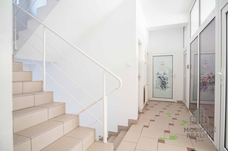Staircase and hallway with white walls in offices.