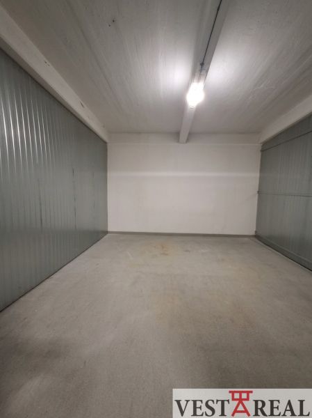 Interior of a space with metal walls and concrete floor.