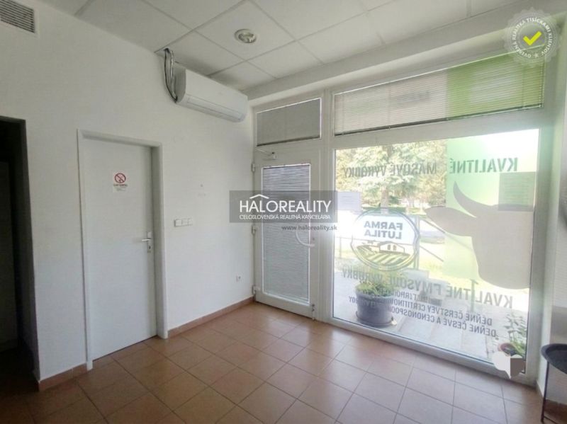 Commercial premises with tiles, air conditioning, and modern glass doors.
