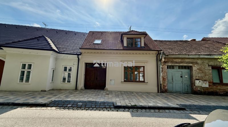 A family house on Pekárska Street in Trnava with a brick facade and a courtyard.