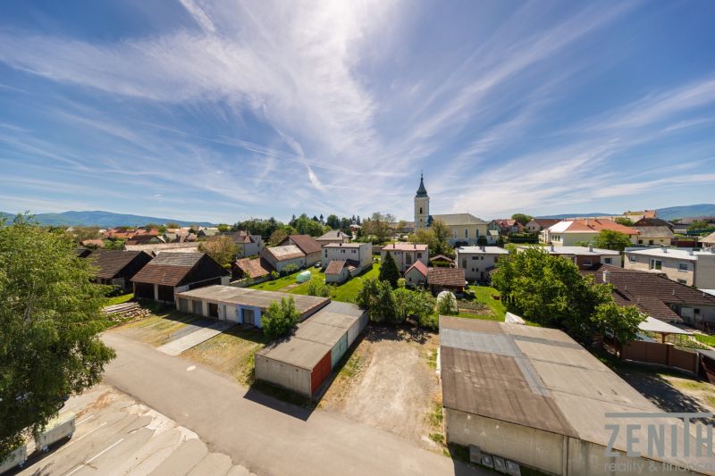 Scenery in Očová with a view of the rooftops and the church.
