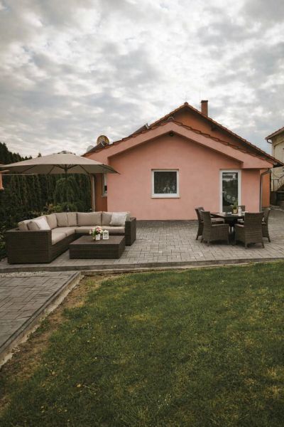 A family house in Martin nad Žitavou on Hlavná Street with a terrace and garden seating.
