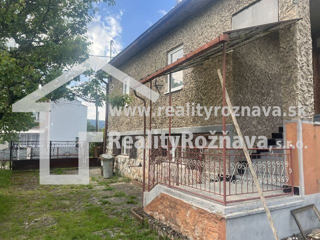 A family house in Rudná with an outdoor terrace and a garden.
