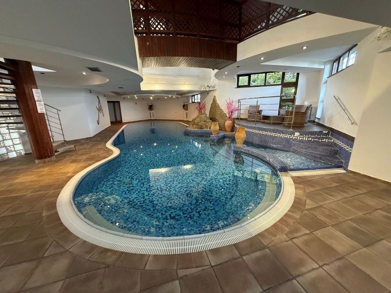 In hotels and guesthouses, there is an indoor pool with mosaic tiles and seating.
