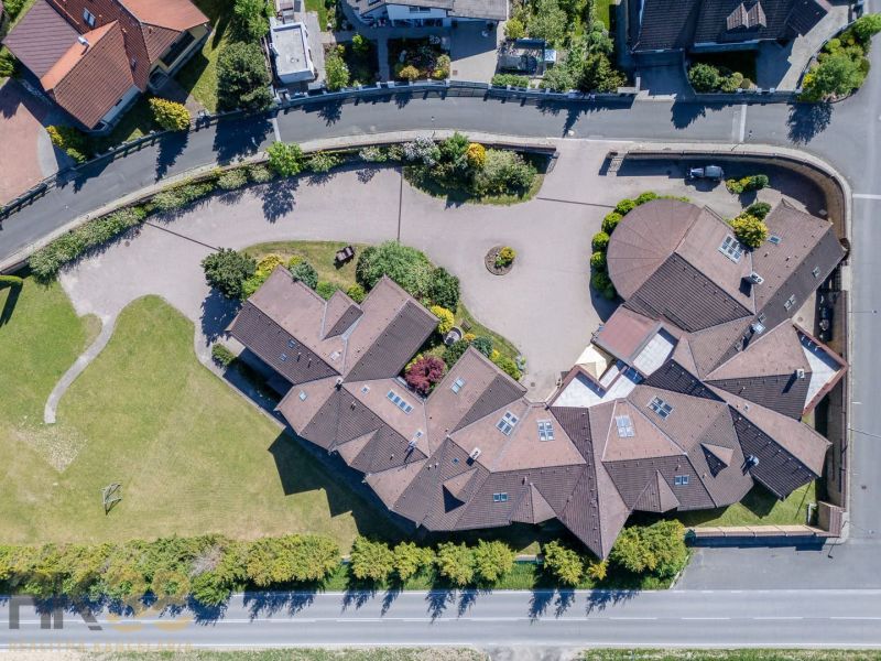 Aerial photograph of the Hotels and Guesthouses complex in Nová Lesná with extensive courtyard and greenery.