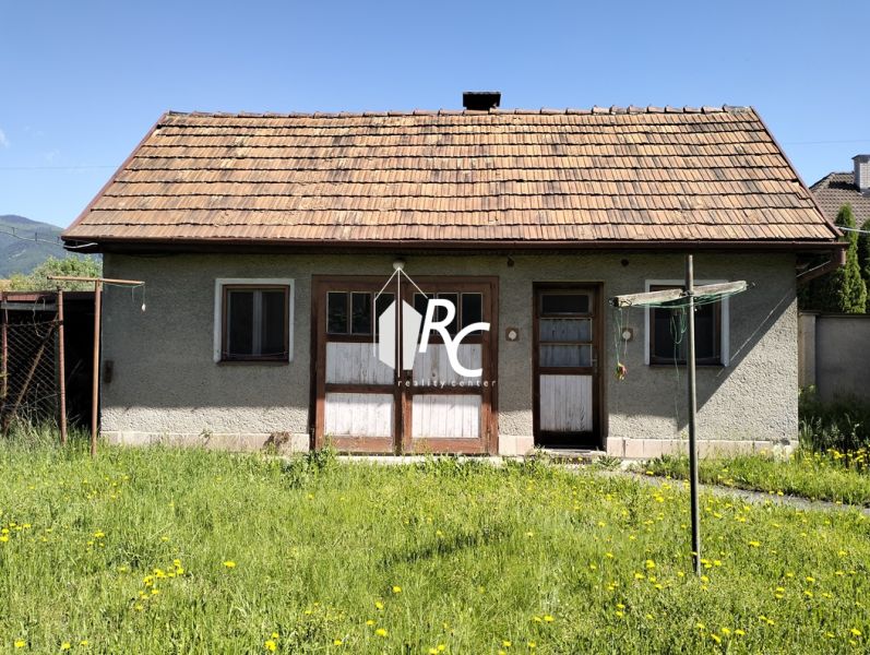 A family house on Štúrova Street in Sučany, with a grassy plot and flowers.