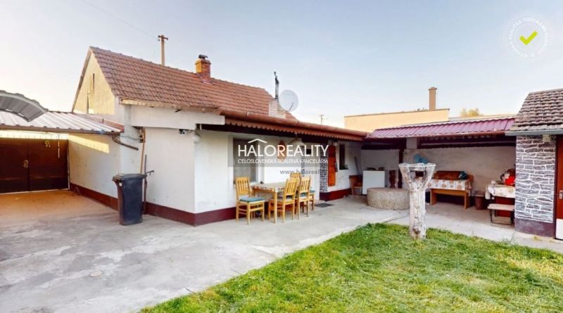 A garden at a family house in Senica with a terrace and outdoor seating.