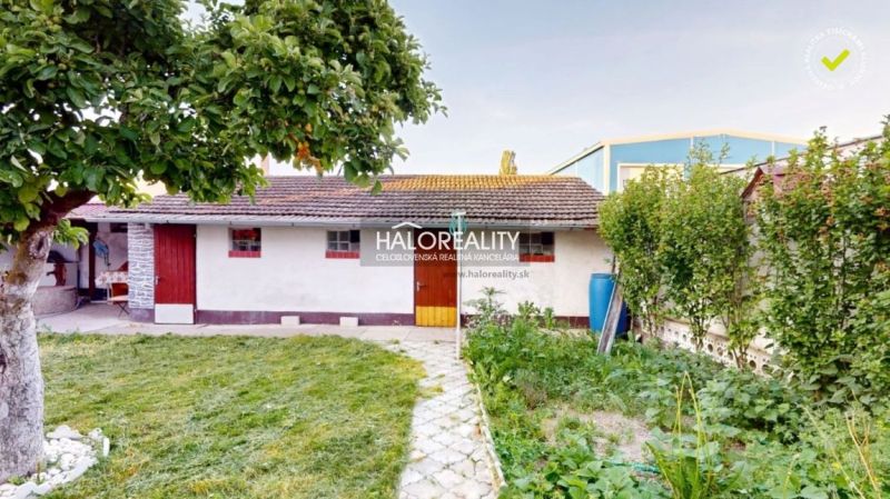 A family house in Senica with a garden, trees, and a garden shed.