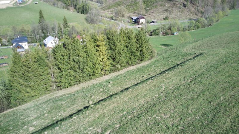 Agricultural and forest lands in Čierny Balog with forests and rural houses.