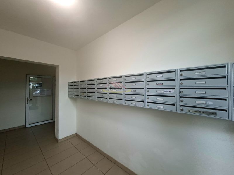 Mailboxes in the entrance hall of the studio apartment, tiled floor, simple design.
