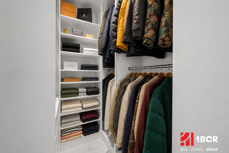A well-organized closet with shelves and hangers in a 3-room apartment.