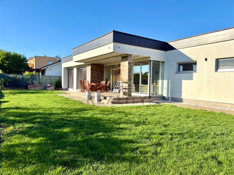 A family house on Lipová Street in Pata with a terrace and a well-maintained lawn.