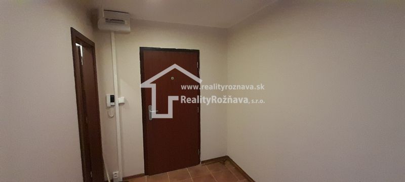 Entrance hall with brown doors in a 2-room apartment, tiles.