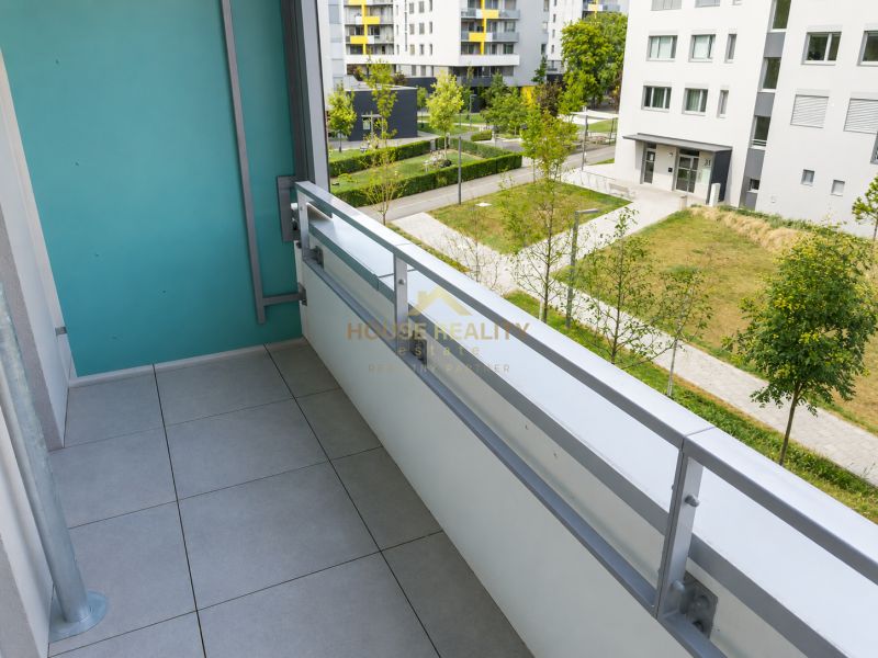 Balcony of a 1-room apartment with a view of greenery on Hraničná Street, Bratislava - Ružinov.