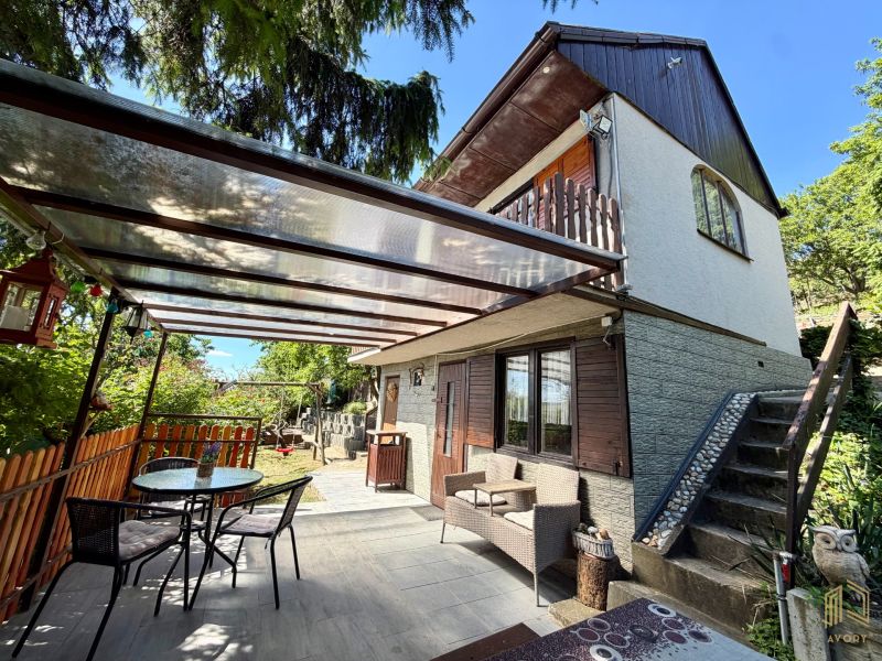 A cottage on Kunov Street in Senica with outdoor seating and garden furniture.