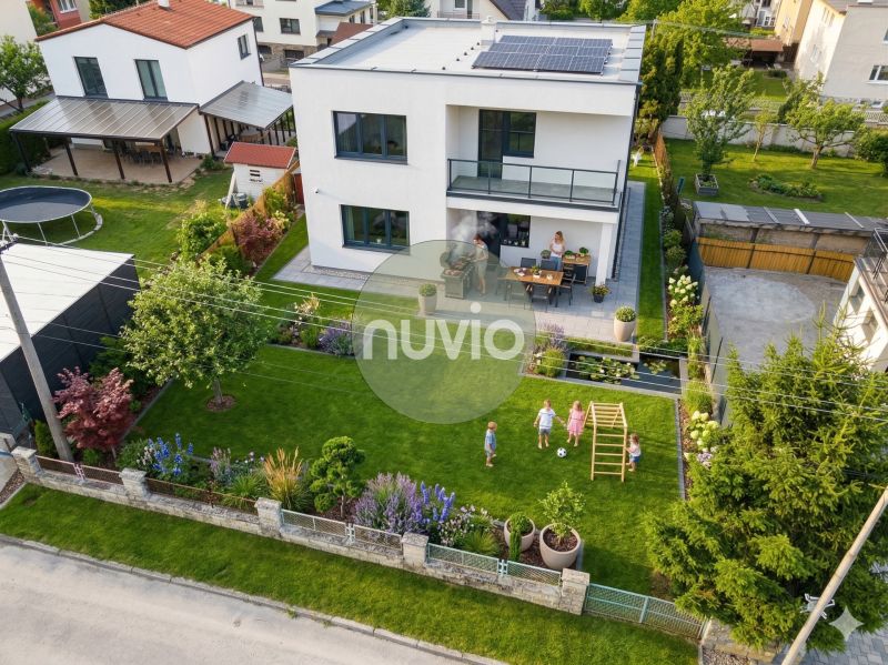 A family house in Martin with a beautiful garden, terrace, and solar panels on the roof.