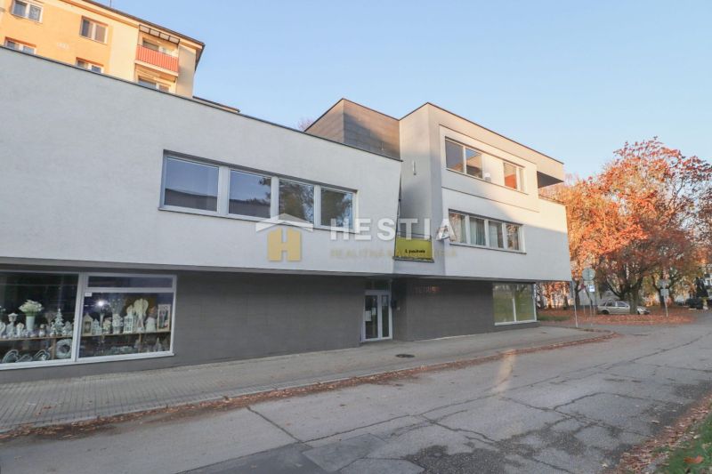 Commercial premises in Senica, a modern building with glass displays on the pedestrian zone.