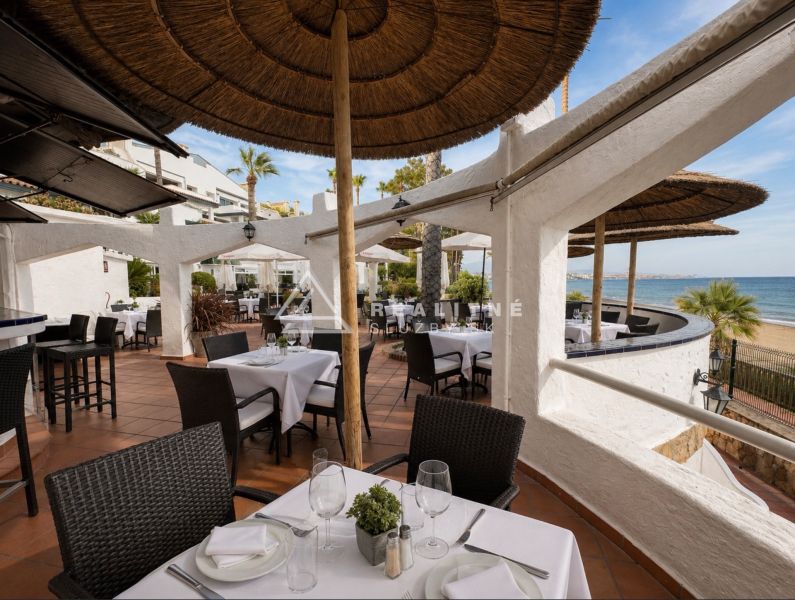 Terrace with a sea view at Dominion Beach in Estepona by a 4-bedroom apartment.