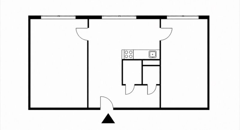 Floor plan of a 2-room apartment with a kitchen, living room, and bathroom.