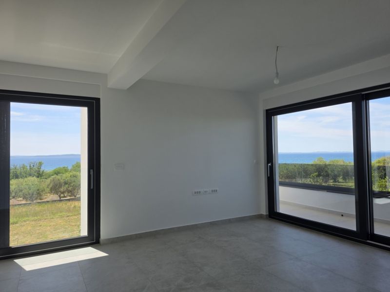 A bright space in a 4-room apartment with large windows and a view of the sea.