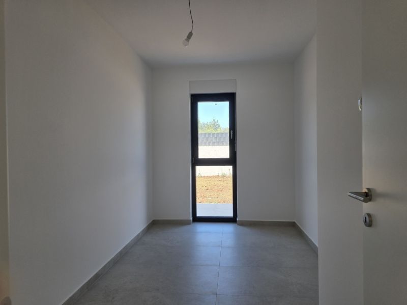 A simple room with glass doors in a 4-room apartment.
