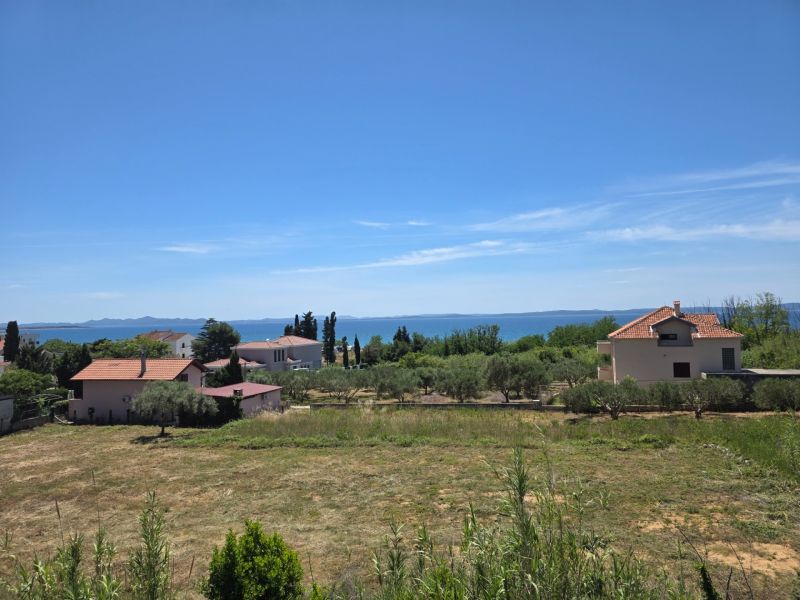 View of the coastline and houses near the sea in Privlaka.